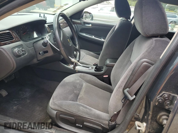 2014 Chevrolet Impala LS with VIN 2G1WA5E33E1127966, listed as a Copart auction lot 61458245 with 166,744 mi miles and Salvage title. Bid and sale history available at DreamBid. Image 7.