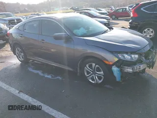 2017 Honda Civic LX z VIN 19XFC2F56HE036732, wystawiony jako IAAI lot #40987182 z przebiegiem 147 781 mil mil oraz . Historia ofert i sprzedaży dostępna na DreamBid. Obrazek 1.