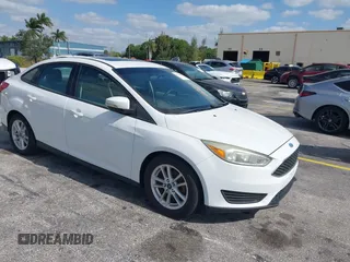 2015 Ford Focus SE with VIN 1FADP3F23FL329375, listed as a IAAI auction lot 42170945 with 114,180 mi miles. Bid and sale history available at carsss.com. Image 1.