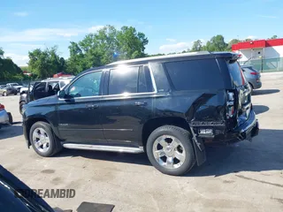 2015 Chevrolet Tahoe LTZ z VIN 1GNSKCKC3FR104845, wystawiony jako IAAI lot #42291785 z przebiegiem 75 047 mil mil oraz . Historia ofert i sprzedaży dostępna na DreamBid. Obrazek 14.