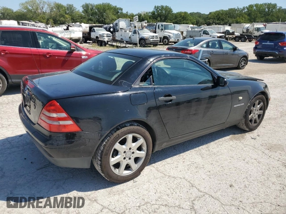 1999 Mercedes-Benz SLK-Class with VIN WDBKK47F5XF129037, listed as a Copart auction lot 68842504 with 74,397 mi miles and Salvage Title. Bid and sale history available at carsss.com. Image 3.