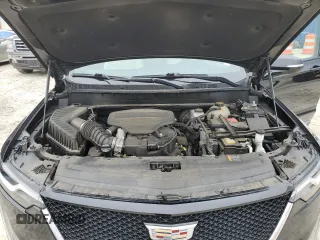2021 Cadillac XT6 Sport z VIN 1GYKPGRS3MZ140296, wystawiony jako Copart lot #46094285 z przebiegiem 49 429 mil mil oraz Szkoda całkowita • Salvage title. Historia ofert i sprzedaży dostępna na DreamBid. Obrazek 12.