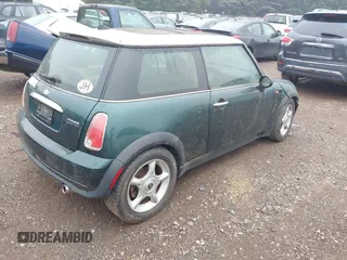 2006 MINI Hardtop with VIN WMWRC33506TK73564, listed as a IAAI auction lot 42602486 with 156,459 mi miles and . Bid and sale history available at DreamBid. Image 4.