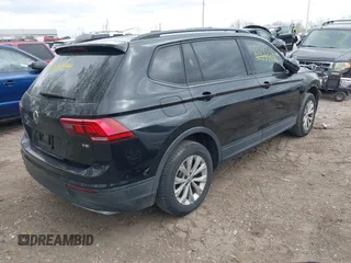 2018 Volkswagen Tiguan S with VIN 3VV1B7AX1JM076071, listed as a IAAI auction lot 42043311 with 107,883 mi miles and . Bid and sale history available at DreamBid. Image 4.