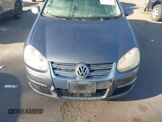 2007 Volkswagen Jetta z VIN 3VWJF71K97M021624, wystawiony jako IAAI lot #41682214 z przebiegiem Nie podano mil oraz . Historia ofert i sprzedaży dostępna na DreamBid. Obrazek 6.