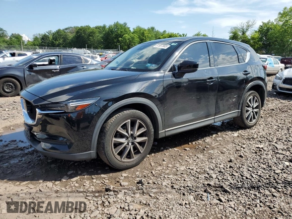 2018 Mazda CX-5 Grand Touring with VIN JM3KFBDM6J0345848, listed as a Copart auction lot 61587865 with 107,193 mi miles and Salvage title. Bid and sale history available at DreamBid. Image 1.