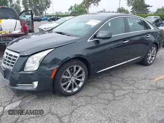 2013 Cadillac XTS Luxury with VIN 2G61P5S33D9215214, listed as a IAAI auction lot 42170402 with 132,045 mi miles and . Bid and sale history available at DreamBid. Image 2.