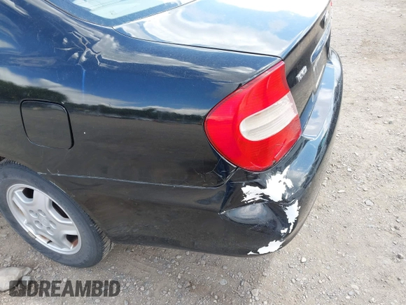 2003 Toyota Camry LE z VIN 4T1BF32KX3U055698, wystawiony jako IAAI lot #42243299 z przebiegiem 167 429 mil mil oraz . Historia ofert i sprzedaży dostępna na DreamBid. Obrazek 6.