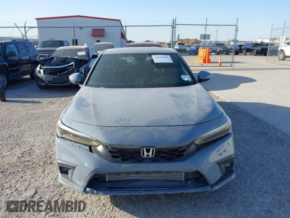 2022 Honda Civic Sport Touring z VIN 19XFL1G89NE009751, wystawiony jako IAAI lot #41845803 z przebiegiem Nie podano mil oraz . Historia ofert i sprzedaży dostępna na DreamBid. Obrazek 11.