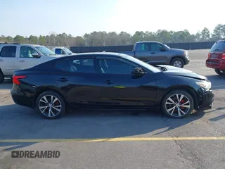 2016 Nissan Maxima SL z VIN 1N4AA6AP1GC383512, wystawiony jako IAAI lot #41490666 z przebiegiem 110 235 mil mil oraz . Historia ofert i sprzedaży dostępna na DreamBid. Obrazek 13.
