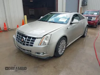 2013 Cadillac CTS Coupe Premium with VIN 1G6DS1E36D0107566, listed as a IAAI auction lot 42079197 with 122,386 mi miles. Bid and sale history available at carsss.com. Image 2.
