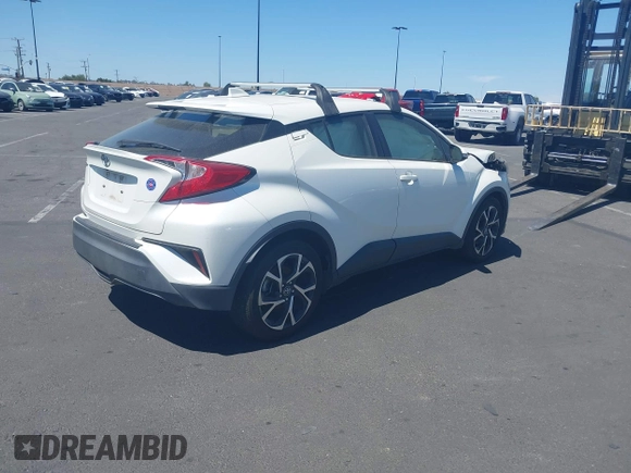 2019 Toyota C-HR XLE with VIN JTNKHMBX4K1040772, listed as a IAAI auction lot 41812031 with 79,729 mi miles. Bid and sale history available at carsss.com. Image 4.