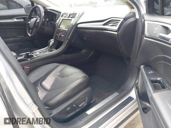 2016 Ford Fusion Titanium z VIN 3FA6P0K92GR135076, wystawiony jako IAAI lot #42604875 z przebiegiem 192 785 mil mil oraz . Historia ofert i sprzedaży dostępna na DreamBid. Obrazek 5.