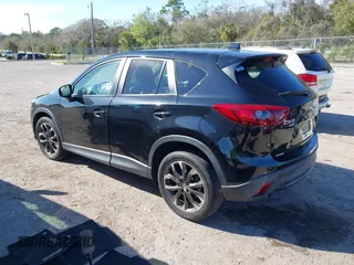 2016 Mazda CX-5 Grand Touring with VIN JM3KE4DY4G0677605, listed as a IAAI auction lot 41642893 with Not Provided miles and . Bid and sale history available at carsss.com. Image 3.