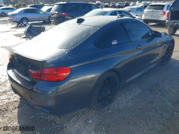 2015 BMW M4 with VIN WBS3R9C57FK334921, listed as a IAAI auction lot 41869773 with 107,058 mi miles. Bid and sale history available at carsss.com. Image 4.