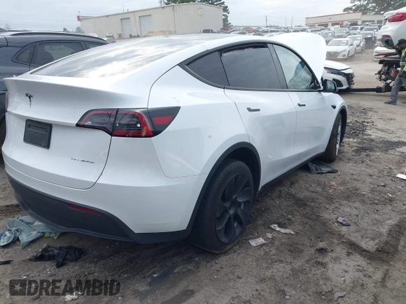 2023 Tesla Model Y Long Range with VIN 7SAYGDEE2PA145398, listed as a IAAI auction lot 41546573 with 20,812 mi miles and . Bid and sale history available at carsss.com. Image 4.