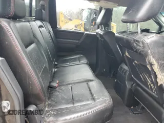 2011 Nissan Titan Pro-4X z VIN 1N6BA0EC2BN325891, wystawiony jako Copart lot #43241505 z przebiegiem Nie podano mil oraz Szkoda całkowita • Salvage title. Historia ofert i sprzedaży dostępna na DreamBid. Obrazek 11.