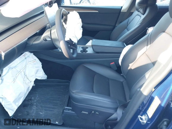 2024 Tesla Model Y Long Range with VIN 7SAYGDEE2RF129577, listed as a IAAI auction lot 41357180 with 6,697 mi miles and . Bid and sale history available at DreamBid. Image 5.