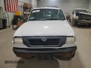 2000 Mazda B-Series 2WD Truck SX with VIN 4F4YR12CXYTM35082, listed as a Copart auction lot 82168854 with 0 mi miles and Salvage Title. Bid and sale history available at carsss.com. Image 5.