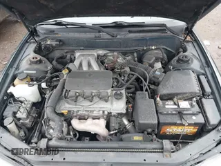 1996 Toyota Camry LE z VIN 4T1EF12K9TU116427, wystawiony jako IAAI lot #38696498 z przebiegiem 242 599 mil mil oraz . Historia ofert i sprzedaży dostępna na DreamBid. Obrazek 10.