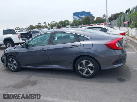 2020 Honda Civic LX z VIN 2HGFC2F60LH596396, wystawiony jako IAAI lot #42354812 z przebiegiem 62 082 mil mil oraz . Historia ofert i sprzedaży dostępna na DreamBid. Obrazek 14.