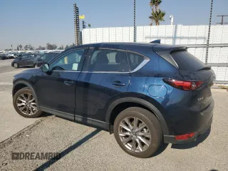 2021 Mazda CX-5 Grand Touring with VIN JM3KFADM7M0385788, listed as a Copart auction lot 88065255 with 27,787 mi miles and Salvage Title. Bid and sale history available at carsss.com. Image 2.