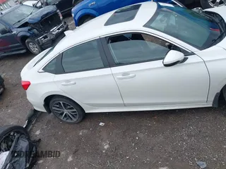 2024 Honda Civic Touring z VIN 2HGFE1F93RH341247, wystawiony jako IAAI lot #42102894 z przebiegiem Nie podano mil oraz . Historia ofert i sprzedaży dostępna na DreamBid. Obrazek 13.