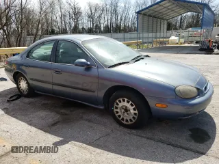 1999 Mercury Sable GS with VIN 1MEFM50U1XA653292, listed as a Copart auction lot 51307905 with 210,945 mi miles and Salvage title. Bid and sale history available at DreamBid. Image 4.