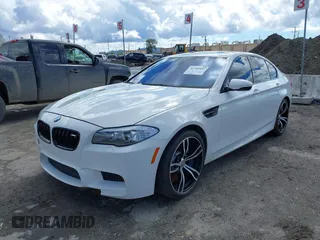 2013 BMW M5 with VIN WBSFV9C56DC772961, listed as a IAAI auction lot 41765457 with 104,568 mi miles. Bid and sale history available at carsss.com. Image 2.