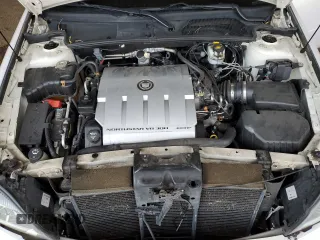 2004 Cadillac DeVille DTS z VIN 1G6KF57944U122824, wystawiony jako Copart lot #86147994 z przebiegiem 118 156 mil mil oraz Szkody całkowita. Historia ofert i sprzedaży dostępna na DreamBid. Obrazek 11.