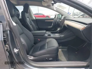 2023 Tesla Model 3 with VIN 5YJ3E1EA7PF417293, listed as a IAAI auction lot 42407659 with 22,578 mi miles and . Bid and sale history available at DreamBid. Image 5.