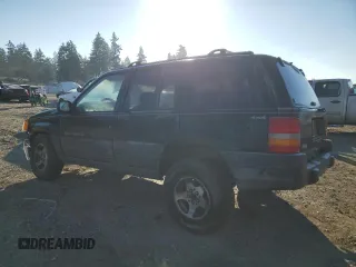 1998 Jeep Grand Cherokee Laredo with VIN 1J4GZ58S0WC106148, listed as a Copart auction lot 42855105 with 263,785 mi miles and Salvage Title. Bid and sale history available at carsss.com. Image 2.