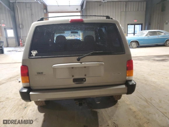 2000 Jeep Cherokee Police with VIN 1J4FT48S4YL275891, listed as a Copart auction lot 76065974 with 138,485 mi miles and Salvage Title. Bid and sale history available at carsss.com. Image 6.