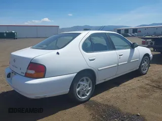 1999 Nissan Altima XE with VIN 1N4DL01D9XC104530, listed as a IAAI auction lot 42141246 with 168,803 mi miles. Bid and sale history available at carsss.com. Image 4.