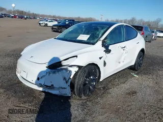 2022 Tesla Model Y Performance with VIN 7SAYGDEF5NF542189, listed as a IAAI auction lot 41643254 with 18,865 mi miles and . Bid and sale history available at DreamBid. Image 18.