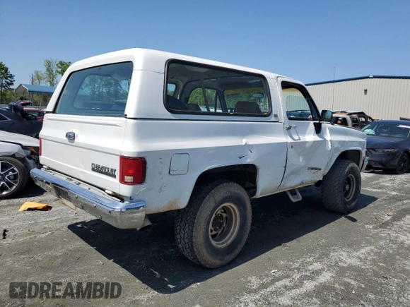 1990 Chevrolet Blazer z VIN 1GNEV18K5LF144221, wystawiony jako Copart lot #52296175 z przebiegiem 114 593 mil mil oraz Szkoda całkowita • Salvage title. Historia ofert i sprzedaży dostępna na DreamBid. Obrazek 3.