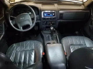 2003 Jeep Grand Cherokee Laredo with VIN 1J4GX48S13C601387, listed as a Copart auction lot 60544295 with 217,485 mi miles and Salvage title. Bid and sale history available at DreamBid. Image 8.