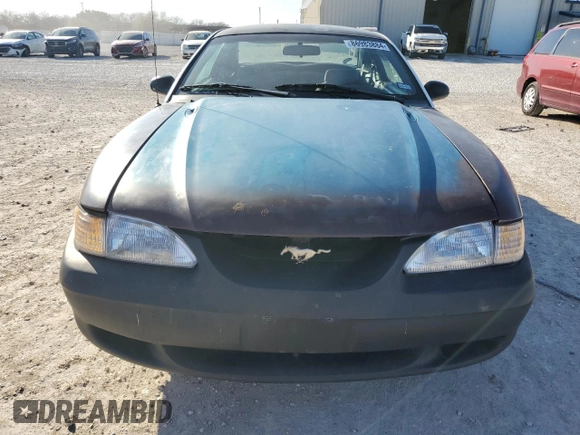 1997 Ford Mustang with VIN 1FALP4043VF174092, listed as a Copart auction lot 86983884 with 105,774 mi miles and Salvage Title. Bid and sale history available at carsss.com. Image 5.