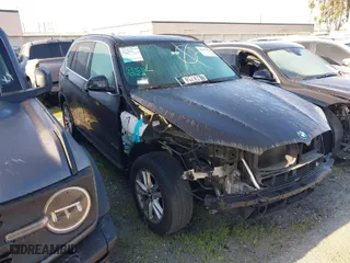 2015 BMW X5 sDrive35i with VIN 5UXKR2C54F0H35124, listed as a IAAI auction lot 41885474 with NaN miles. Bid and sale history available at carsss.com. Image 1.