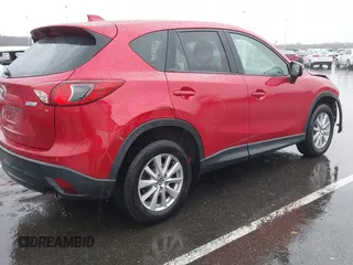 2015 Mazda CX-5 Touring with VIN JM3KE4CY3F0529669, listed as a IAAI auction lot 41866873 with 137,635 mi miles and . Bid and sale history available at carsss.com. Image 4.