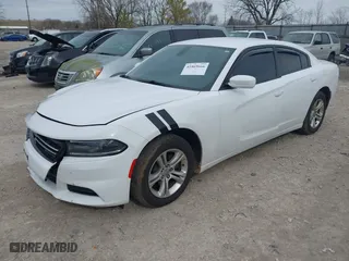 2015 Dodge Charger SE with VIN 2C3CDXBGXFH812015, listed as a IAAI auction lot 41869666 with 108,823 mi miles. Bid and sale history available at carsss.com. Image 2.