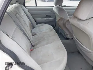 2003 Ford Crown Victoria LX z VIN 2FAFP74WX3X154904, wystawiony jako IAAI lot #42094274 z przebiegiem 123 579 mil mil oraz . Historia ofert i sprzedaży dostępna na DreamBid. Obrazek 8.