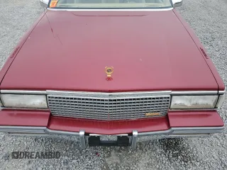 1987 Cadillac DeVille z VIN 1G6CD1181H4318101, wystawiony jako Copart lot #75354324 z przebiegiem Nie podano mil oraz Szkoda całkowita • Salvage title. Historia ofert i sprzedaży dostępna na DreamBid. Obrazek 11.