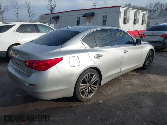 2015 Infiniti Q50 Premium z VIN JN1BV7AR8FM417712, wystawiony jako IAAI lot #41427839 z przebiegiem 88 424 mil mil oraz . Historia ofert i sprzedaży dostępna na DreamBid. Obrazek 4.