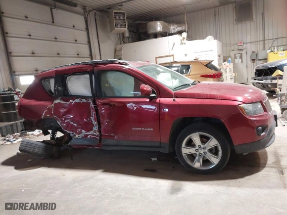 2014 Jeep Compass Latitude with VIN 1C4NJCEB9ED717575, listed as a IAAI auction lot 41532566 with 128,821 mi miles. Bid and sale history available at carsss.com. Image 13.