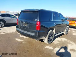 2015 Chevrolet Tahoe LTZ with VIN 1GNSCCKC4FR186632, listed as a IAAI auction lot 41482904 with 149,468 mi miles. Bid and sale history available at carsss.com. Image 4.
