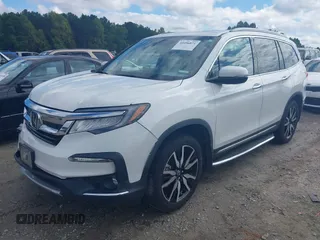 2020 Honda Pilot Elite with VIN 5FNYF6H08LB014288, listed as a IAAI auction lot 40496871 with 57,921 mi miles and . Bid and sale history available at DreamBid. Image 19.