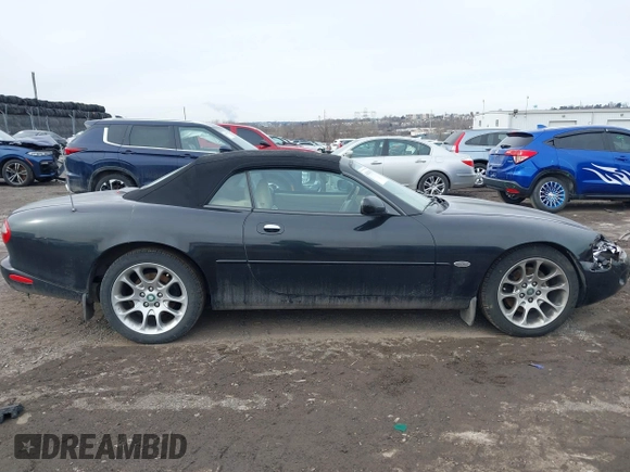 1997 Jaguar XK with VIN SAJGX274XVC017622, listed as a IAAI auction lot 41614339 with 94,298 mi miles and . Bid and sale history available at DreamBid. Image 12.