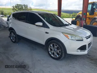 2013 Ford Escape SEL with VIN 1FMCU0HX9DUB02975, listed as a IAAI auction lot 42546346 with 129,501 mi miles and . Bid and sale history available at DreamBid. Image 1.