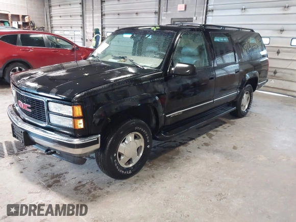 1999 GMC Suburban z VIN 3GKFK16R3XG529761, wystawiony jako IAAI lot #42272646 z przebiegiem 269 114 mil mil oraz . Historia ofert i sprzedaży dostępna na DreamBid. Obrazek 2.
